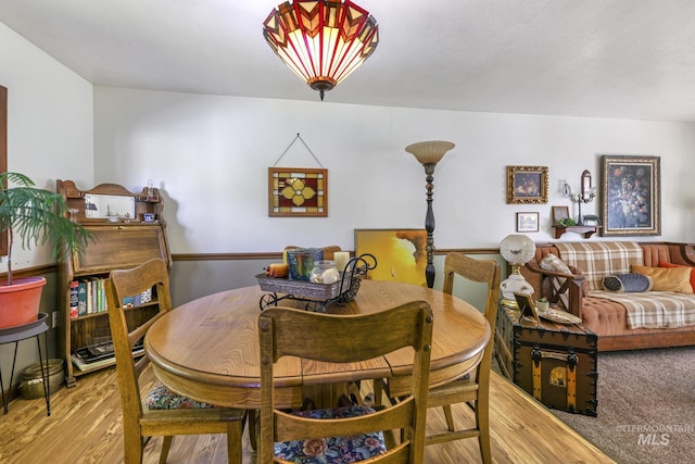 dining space featuring light wood-style floors