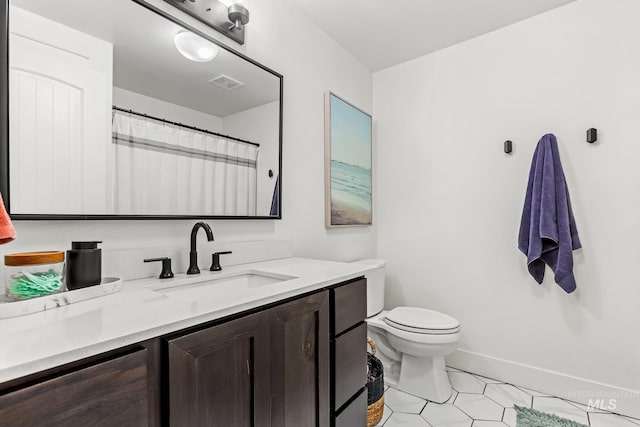 full bath featuring visible vents, toilet, vanity, and baseboards