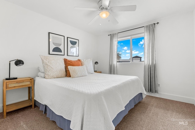 carpeted bedroom with baseboards and ceiling fan