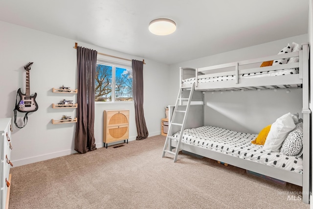 bedroom featuring carpet flooring, visible vents, and baseboards