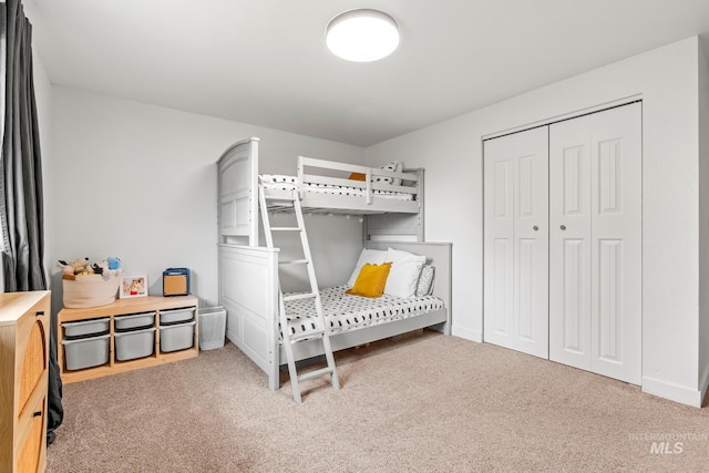 bedroom with baseboards and carpet floors