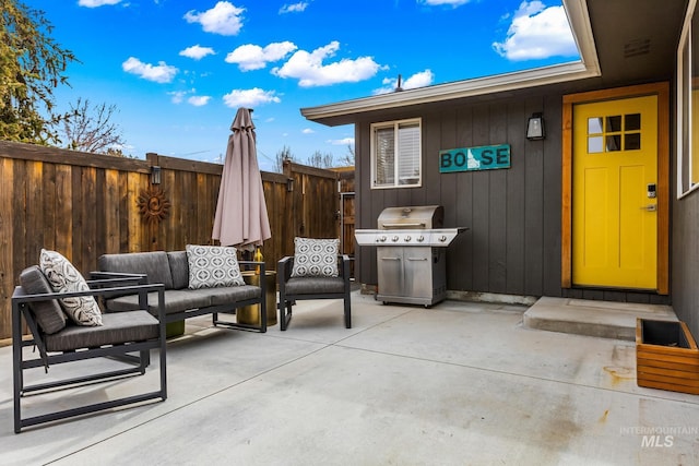 view of patio / terrace featuring an outdoor living space, area for grilling, and fence