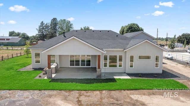 1360 Jordan Ln, Emmett, ID 83617 - rear view of property with roof with shingles, a patio area, and stucco siding