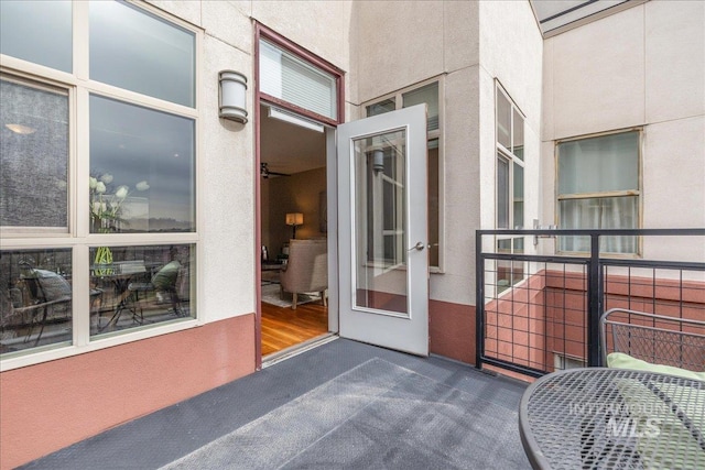 view of exterior entry with stucco siding