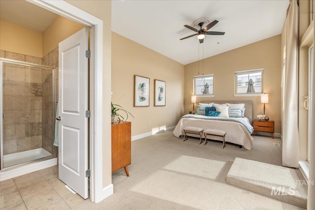 carpeted bedroom featuring lofted ceiling, baseboards, and a ceiling fan