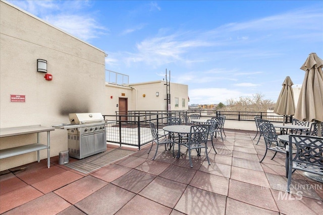 view of patio / terrace with grilling area and outdoor dining area