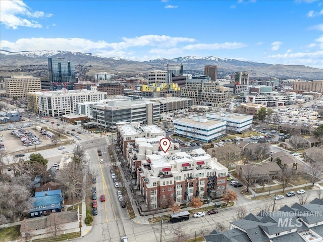 birds eye view of property featuring a view of city and a mountain view