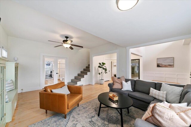 609 10th Ave S, Nampa, ID 83651 - living area featuring stairway, a ceiling fan, french doors, and light wood-style flooring