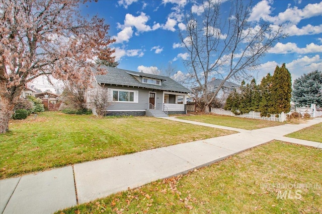 609 10th Ave S, Nampa, ID 83651 - bungalow-style house with fence, covered porch, and a front yard