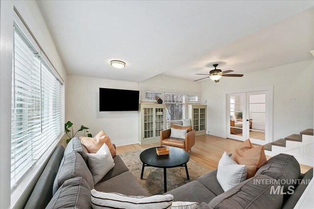 609 10th Ave S, Nampa, ID 83651 - living room with french doors, light wood-style flooring, and a healthy amount of sunlight