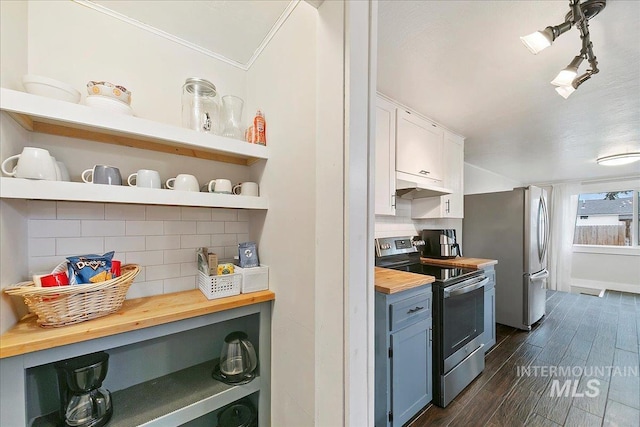 609 10th Ave S, Nampa, ID 83651 - kitchen with stainless steel appliances, under cabinet range hood, open shelves, butcher block counters, and tasteful backsplash