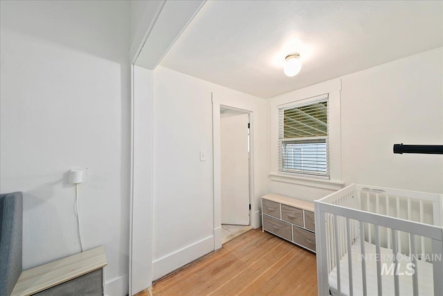 609 10th Ave S, Nampa, ID 83651 - unfurnished bedroom featuring baseboards and light wood finished floors