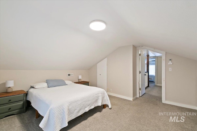 609 10th Ave S, Nampa, ID 83651 - bedroom with vaulted ceiling, visible vents, baseboards, and light carpet