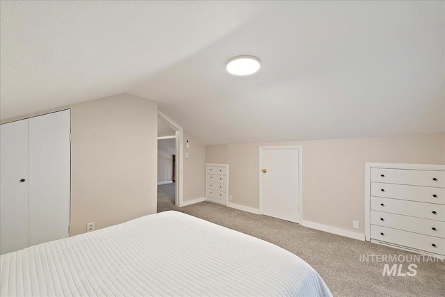 609 10th Ave S, Nampa, ID 83651 - carpeted bedroom with lofted ceiling and baseboards