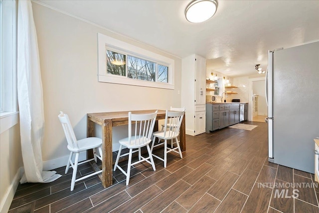 609 10th Ave S, Nampa, ID 83651 - dining room with baseboards and wood tiled floor