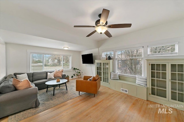 609 10th Ave S, Nampa, ID 83651 - living area featuring light wood finished floors, a ceiling fan, and visible vents