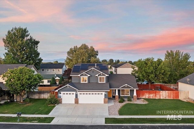 80 Cobblestone Ct, Middleton, ID 83644 - view of front of home with roof mounted solar panels, concrete driveway, a garage, and a residential view