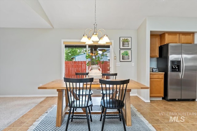 80 Cobblestone Ct, Middleton, ID 83644 - dining space with a chandelier, light tile patterned floors, and baseboards