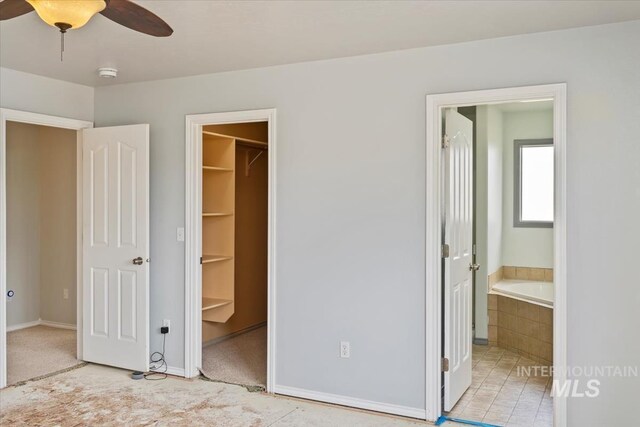 80 Cobblestone Ct, Middleton, ID 83644 - unfurnished bedroom with a spacious closet, ensuite bathroom, a closet, and baseboards