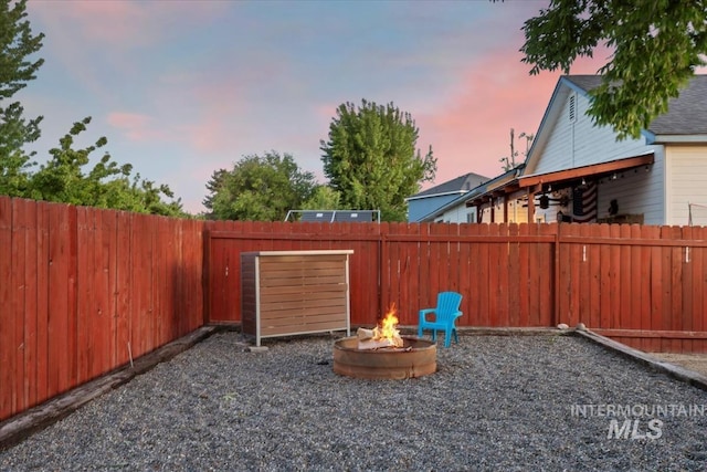 80 Cobblestone Ct, Middleton, ID 83644 - fenced backyard with an outdoor fire pit