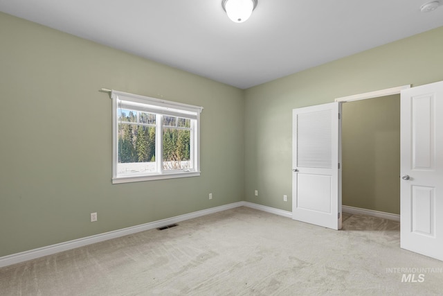828 W Fork Eagle Creek Rd, Wallace, ID 83873 - unfurnished bedroom featuring light carpet and baseboards