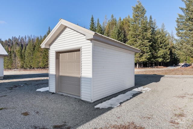 828 W Fork Eagle Creek Rd, Wallace, ID 83873 - detached garage featuring a wooded view