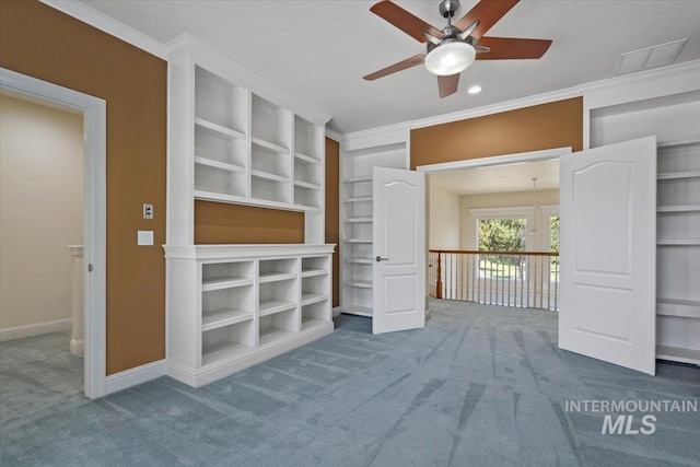 unfurnished bedroom with carpet floors, crown molding, baseboards, and a ceiling fan