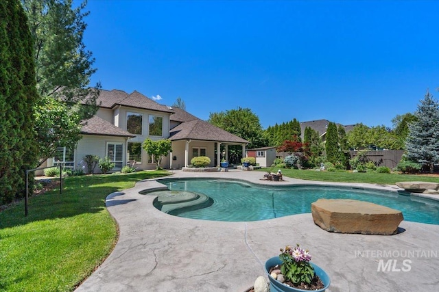 view of swimming pool with a patio
