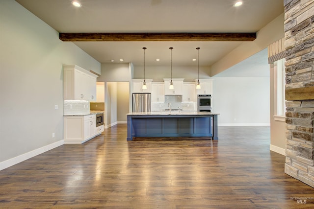 kitchen featuring backsplash, stainless steel appliances, and white cabinets