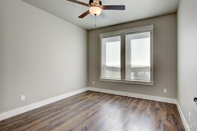 empty room with hardwood / wood-style flooring and ceiling fan