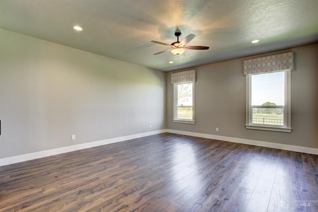 unfurnished room with ceiling fan, a textured ceiling, and hardwood / wood-style floors