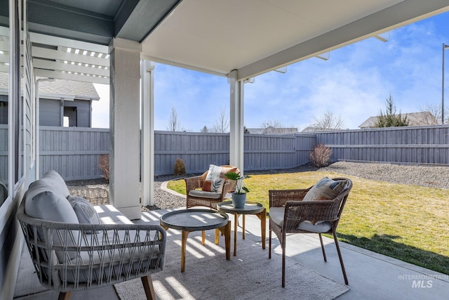 view of patio featuring an outdoor hangout area and a fenced backyard