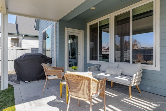 view of patio / terrace featuring an outdoor living space, area for grilling, and fence