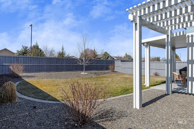 view of yard featuring a patio, a fenced backyard, and a pergola