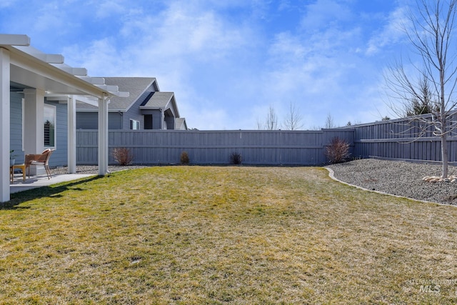 view of yard featuring a patio and a fenced backyard