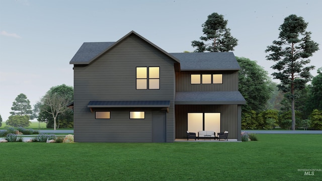 2930 W Neff St, Boise, ID 83703 - back of property at dusk with a yard, a shingled roof, and a patio area