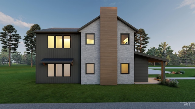 2930 W Neff St, Boise, ID 83703 - back of house featuring stone siding, a yard, a chimney, and a standing seam roof