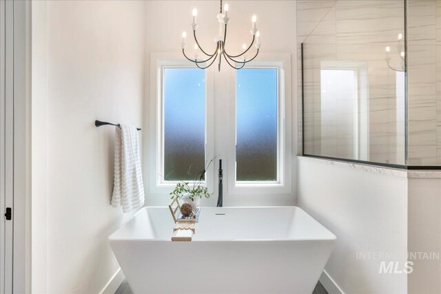 505 Stonehedge Loop, Twin Falls, ID 83301 - full bath featuring a freestanding tub and a chandelier
