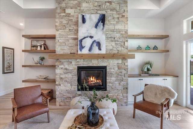 505 Stonehedge Loop, Twin Falls, ID 83301 - living area featuring a stone fireplace and light wood-type flooring