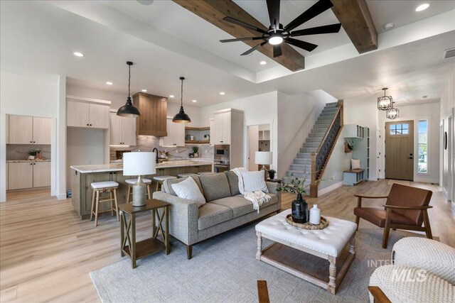 505 Stonehedge Loop, Twin Falls, ID 83301 - living room with light wood-style floors, recessed lighting, beam ceiling, stairs, and ceiling fan