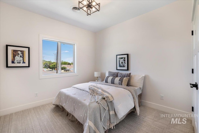 505 Stonehedge Loop, Twin Falls, ID 83301 - carpeted bedroom with baseboards and a chandelier