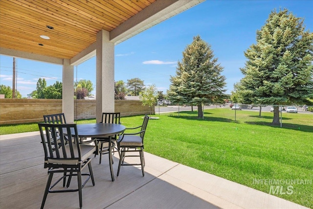 505 Stonehedge Loop, Twin Falls, ID 83301 - fenced backyard featuring outdoor dining space and a patio