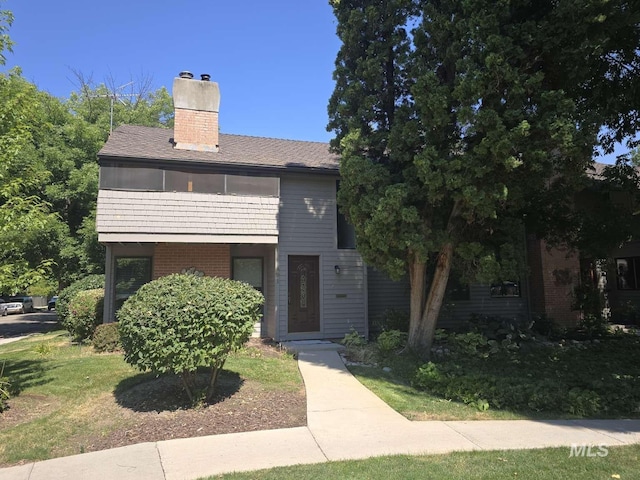 view of front of home with a front yard