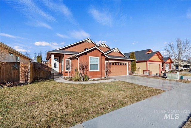 view of front of property featuring a front lawn and a garage