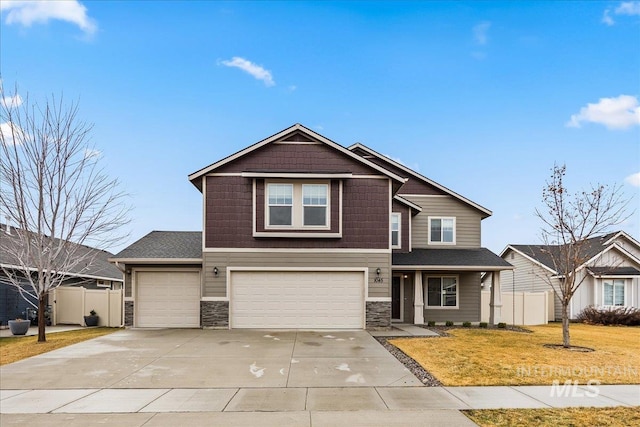 view of front of house with a garage and a front yard