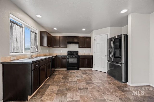 kitchen featuring dark brown cabinetry, sink, and black appliances