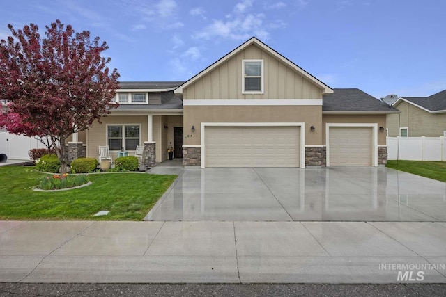 craftsman house with stone siding, a porch, an attached garage, and driveway