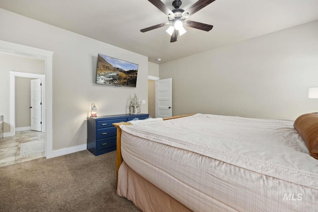 bedroom featuring carpet floors, baseboards, and ceiling fan