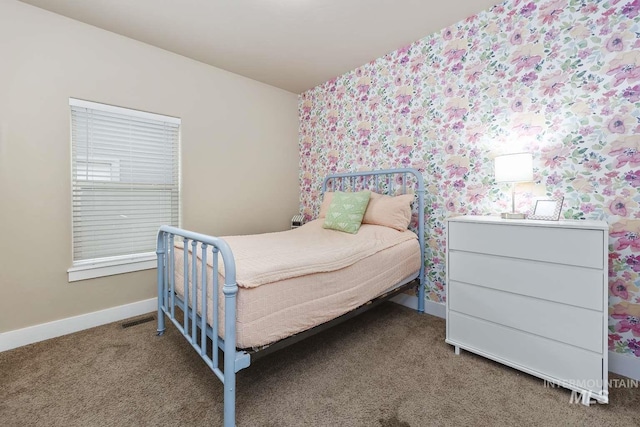 bedroom featuring wallpapered walls, baseboards, and carpet flooring