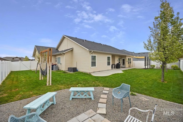 rear view of property featuring a patio and central AC unit